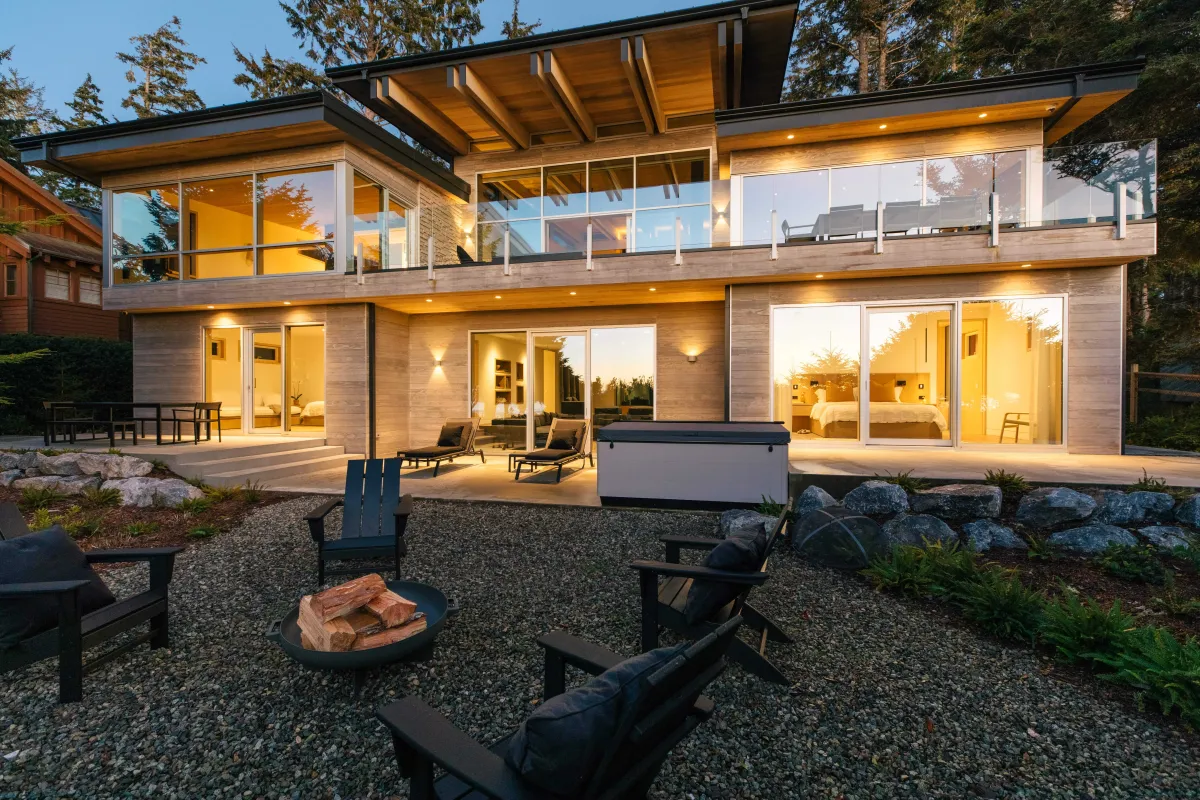 Tofino-beach-house-curtain-wall-timber-windows-raico-backyard